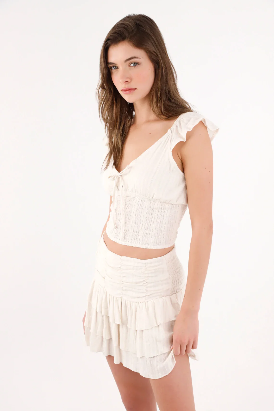 Fitted cropped blouse with bow and smocking in off-white cotton for women - Image 2