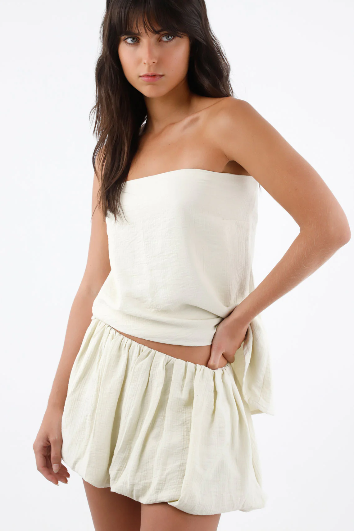 Ivory Strapless Top for Women in Lightweight Fabric with Asymmetrical Hem - Image 4